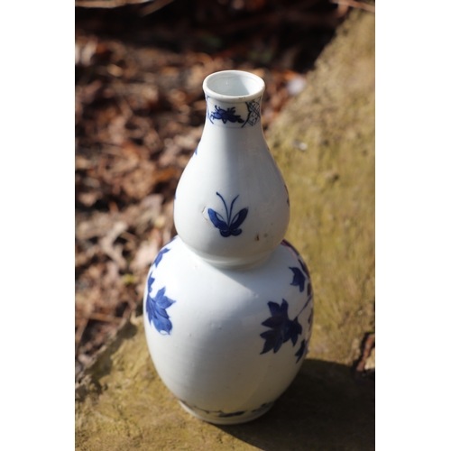 968 - A Chinese blue & white double gourd vase decorated with a bird amongst flowering foliage, four chara... 