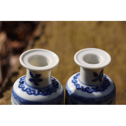 979 - A pair of Chinese blue & white vases decorated with flowers, blue artemisia mark to the underside, 1... 