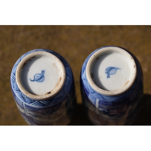 979 - A pair of Chinese blue & white vases decorated with flowers, blue artemisia mark to the underside, 1... 