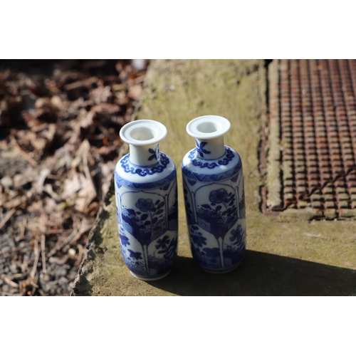 979 - A pair of Chinese blue & white vases decorated with flowers, blue artemisia mark to the underside, 1... 