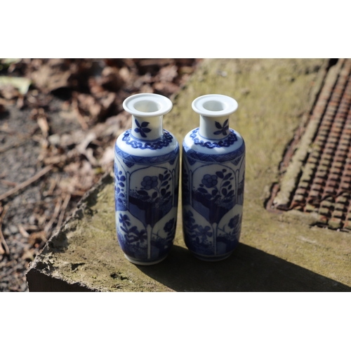 979 - A pair of Chinese blue & white vases decorated with flowers, blue artemisia mark to the underside, 1... 