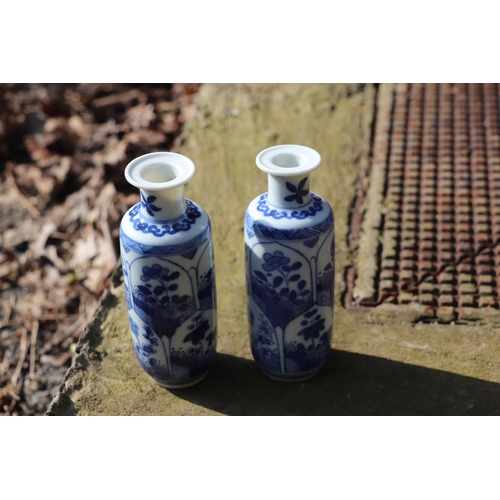 979 - A pair of Chinese blue & white vases decorated with flowers, blue artemisia mark to the underside, 1... 