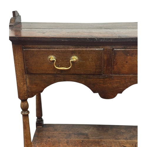 1078 - An oak dresser, 18th century elements and later, the raised plate rack with two shelves above three ... 