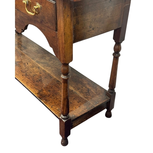 1078 - An oak dresser, 18th century elements and later, the raised plate rack with two shelves above three ... 