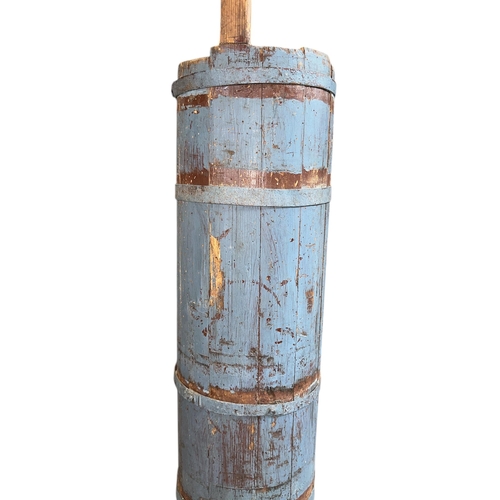 18 - A large metal bound butter churn, 89cms high.
