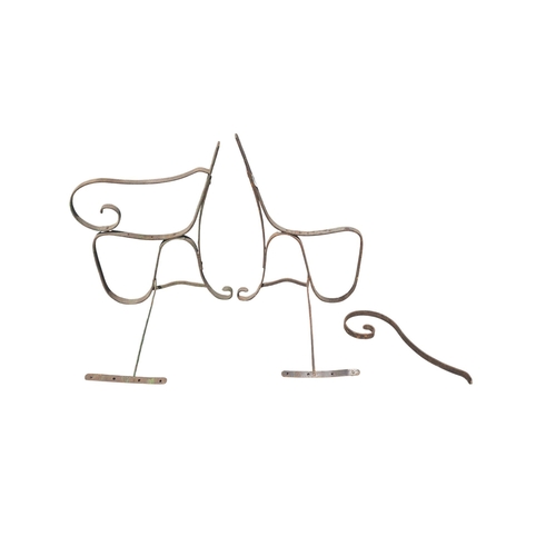 24 - A pair of painted metal strapwork bench ends, each approx 63cms high (2).