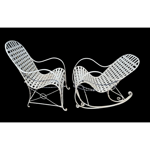 5 - A distressed painted metal garden rocking chair with woven slat seat; together with a similar elbow ... 