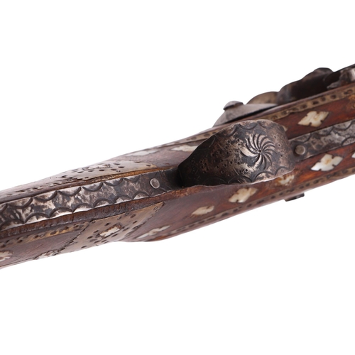52 - A 19th century Jezail Indo-Persian flintlock rifle with mother of pearl inlaid decoration, 126cms lo... 