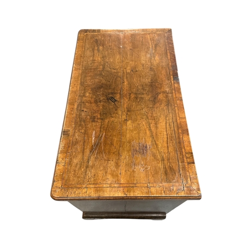 914 - An 18th century walnut chest with brushing slide above four graduated long drawers, on bracket feet,... 