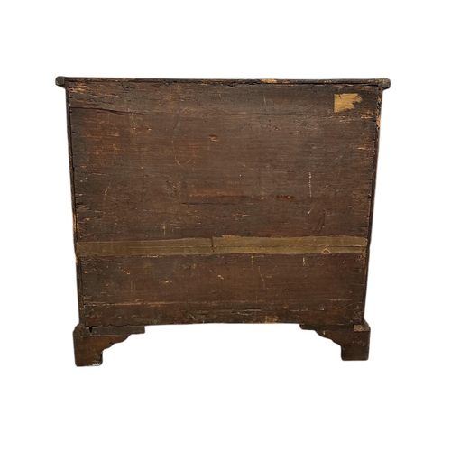914 - An 18th century walnut chest with brushing slide above four graduated long drawers, on bracket feet,... 