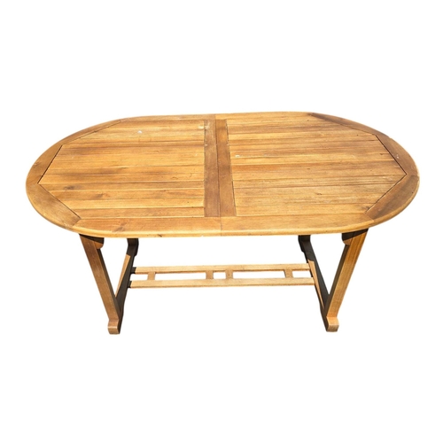 6 - A teak extending garden table, 90 by 150cms unextended.