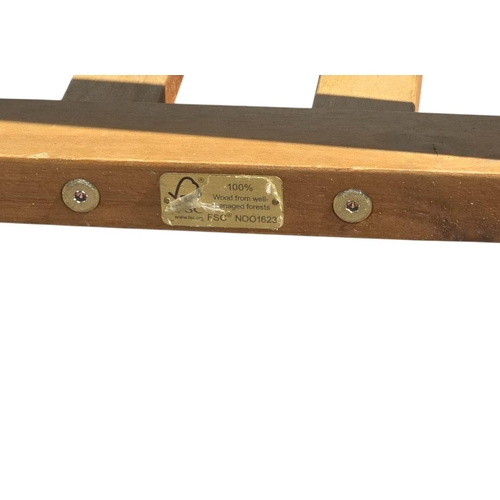 6 - A teak extending garden table, 90 by 150cms unextended.