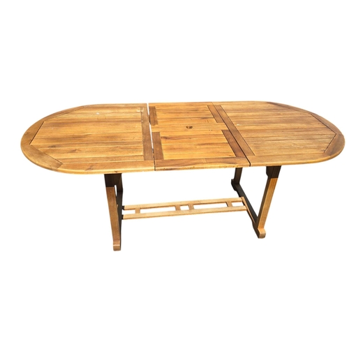 6 - A teak extending garden table, 90 by 150cms unextended.