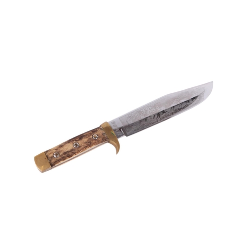101 - A mid 20th century Bowie knife with brass mounted antler handle in a tooled leather scabbard, the bl... 