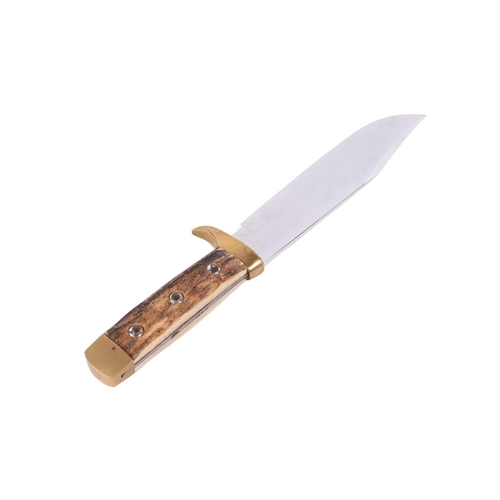 101 - A mid 20th century Bowie knife with brass mounted antler handle in a tooled leather scabbard, the bl... 