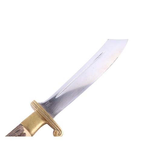 102 - A mid 20th century original Texas hunters knife with a brass mounted antler handle, the blade decora... 
