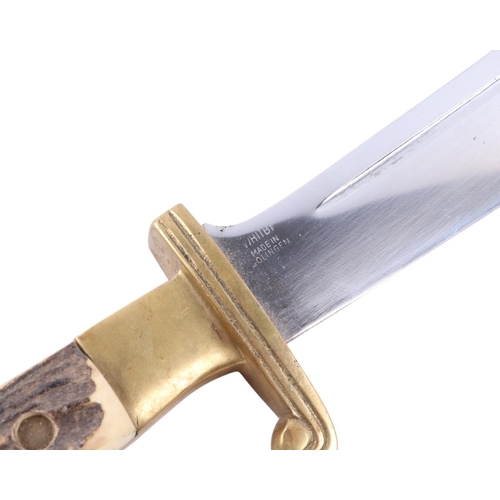 102 - A mid 20th century original Texas hunters knife with a brass mounted antler handle, the blade decora... 