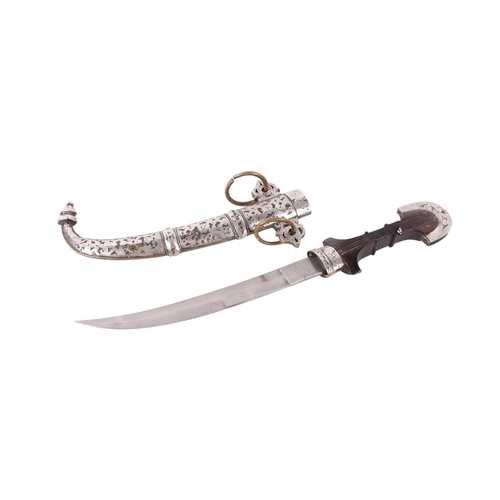 106 - A late 19th / early 20th century North African Koummya dagger with white metal mounted hardwood hand... 