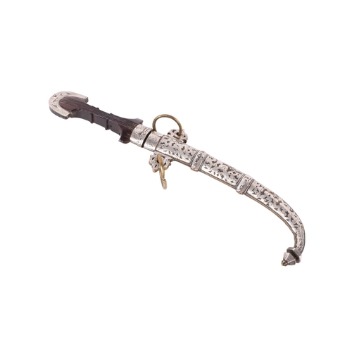106 - A late 19th / early 20th century North African Koummya dagger with white metal mounted hardwood hand... 