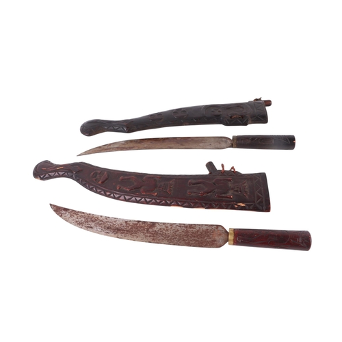 107 - Two early / mid 20th century Taiwan aboriginal swords with carved hardwood scabbards, each approx 61... 