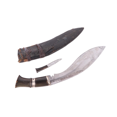 109 - A Dui Chira kukri with horn handle and white metal mounts, in a leather sheath, overall 46cms long, ... 