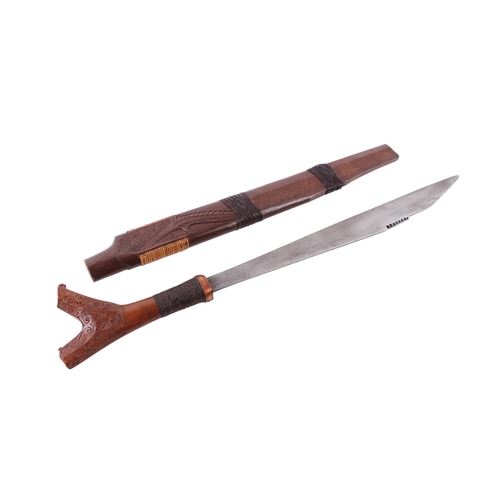 110 - A 20th century Sarawak / Malay small Mandau sword with carved hardwood and woven rattan handle, the ... 