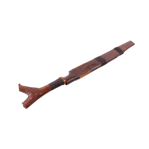 110 - A 20th century Sarawak / Malay small Mandau sword with carved hardwood and woven rattan handle, the ... 