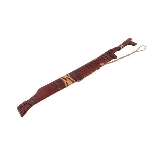 60 - A mid 20th century small Borneo Kayan Mandau Dayak sword and scabbard, overall 64cms, blade length 4... 