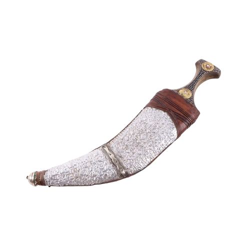 65 - A mid 20th century Islamic Yemini Arab jambiya knife / dagger, the horn handle with bronze alloy coi... 