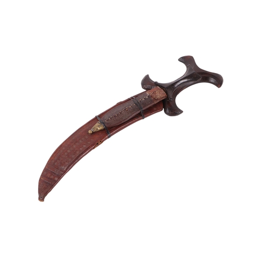 67 - An early 20th century East African Hedendoa knife / dagger with shaped hardwood handle and steel bla... 