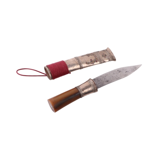 69 - A 19th century Shan Tai - Thai Dha dagger with white metal mounted horn handle and white metal and e... 