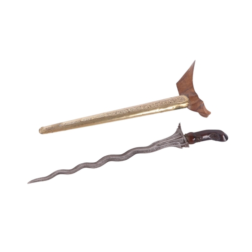 70 - A 19th century Javanese Kris with pamor wavy steel blade, carved hardwood handle and engraved brass ... 