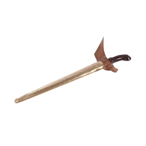 70 - A 19th century Javanese Kris with pamor wavy steel blade, carved hardwood handle and engraved brass ... 