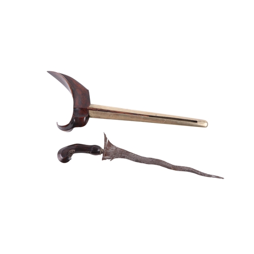 72 - A 19th century Javanese Kris / Keris Yogyakarta knife with carved hardwood handle and wavy steel bla... 