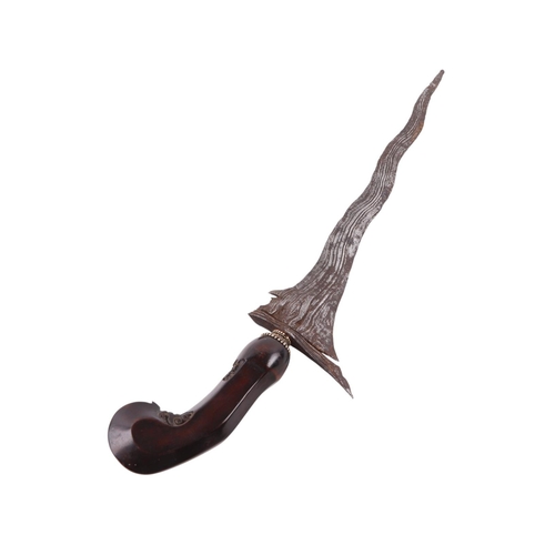 72 - A 19th century Javanese Kris / Keris Yogyakarta knife with carved hardwood handle and wavy steel bla... 