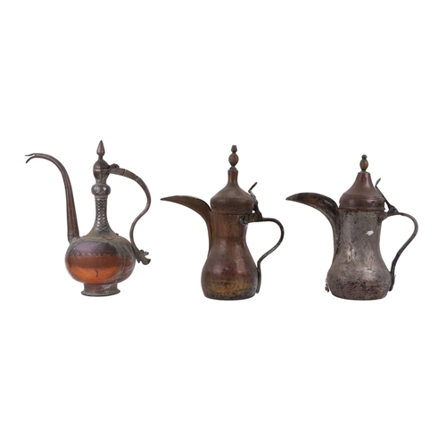 733 - A Turkish / Islamic brass dallah coffee pot, 35cms high; together with a tinned copper Islamic / Tur... 