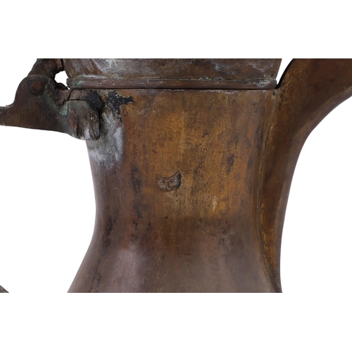 733 - A Turkish / Islamic brass dallah coffee pot, 35cms high; together with a tinned copper Islamic / Tur... 
