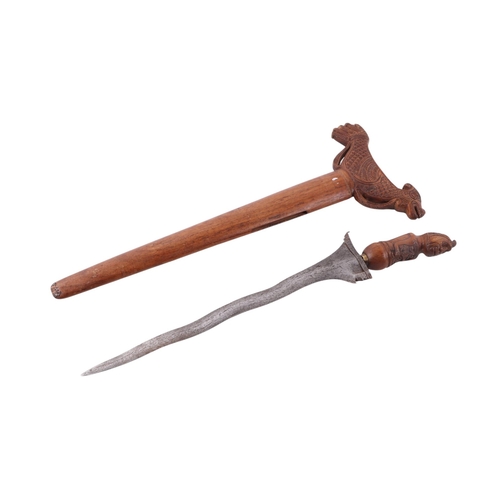 74 - A Javanese Madura Kris / Keris with figural carved hardwood handle and hardwood scabbard with stylis... 