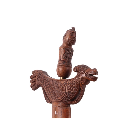 74 - A Javanese Madura Kris / Keris with figural carved hardwood handle and hardwood scabbard with stylis... 