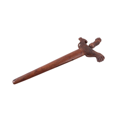 74 - A Javanese Madura Kris / Keris with figural carved hardwood handle and hardwood scabbard with stylis... 