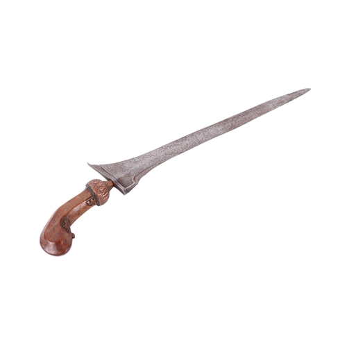 75 - A Javanese Kris / Keris with carved hardwood handle and copper Mendak and having a wavy steel pamor ... 