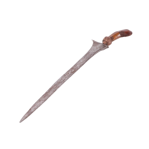 75 - A Javanese Kris / Keris with carved hardwood handle and copper Mendak and having a wavy steel pamor ... 