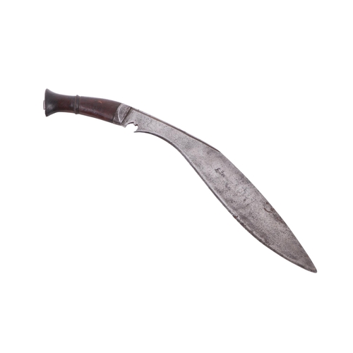 81 - An early 20th century regimental kukri knife with various indistinct stamped marks to the blade, the... 