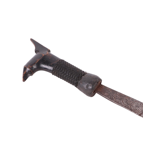 82 - An early 20th century Borneo Kayan Mandau sword with wooden and woven rattan handle, with rattan bou... 