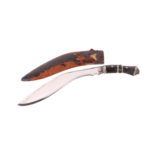 84 - A mid 20th century kukri knife with nickel mounted horn handle and lion terminal, the chromed blade ... 
