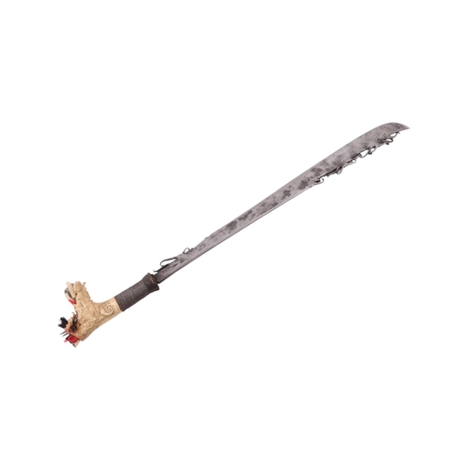 85 - An early to mid 20th century Borneo Mandau sword with carved stag antler and steel wire grip handle ... 
