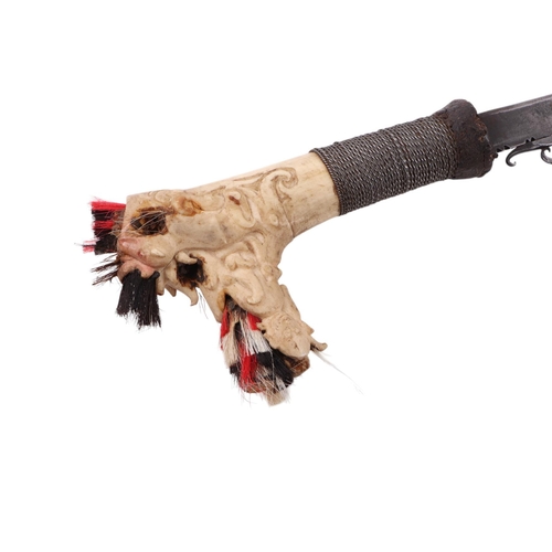85 - An early to mid 20th century Borneo Mandau sword with carved stag antler and steel wire grip handle ... 