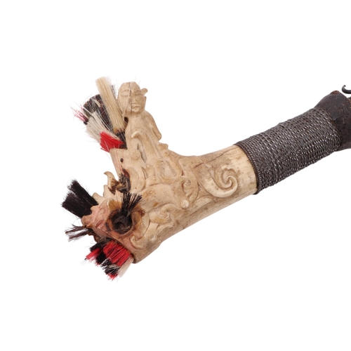 85 - An early to mid 20th century Borneo Mandau sword with carved stag antler and steel wire grip handle ... 