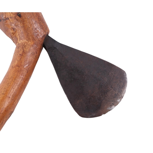 88 - An African Congo Chokwe war axe with steel blade and wooden ball ended shaft, 63cms long.