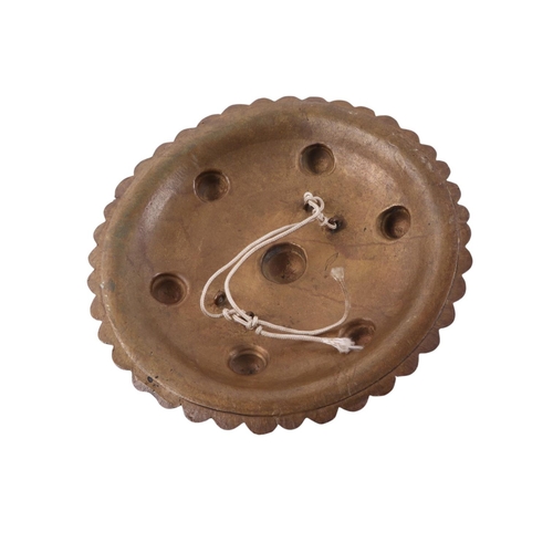 91 - A Sumatran Acehnese Peurise Teumaga brass shield, 26cms diameter.